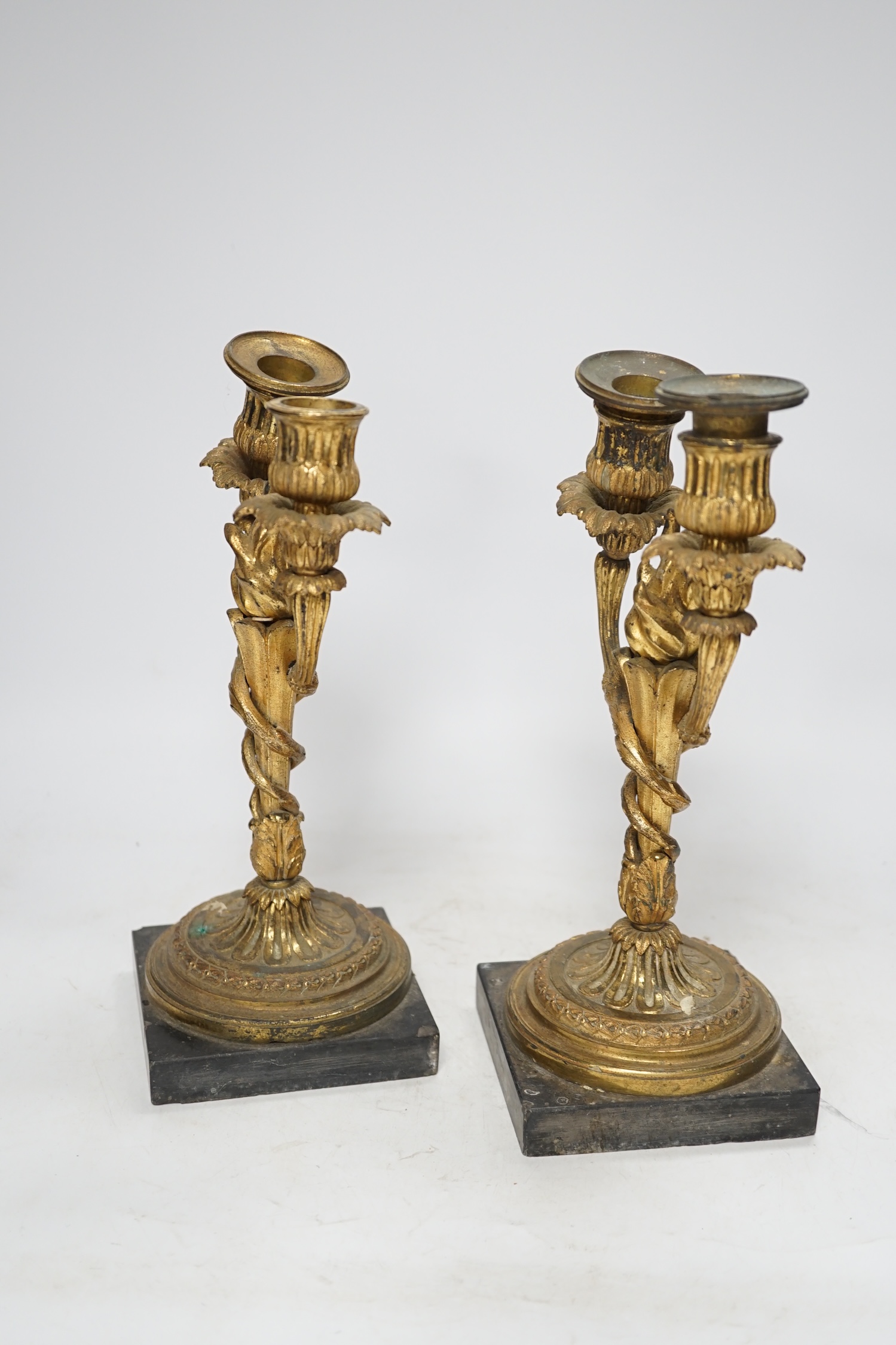 A pair of 19th century Louis XVI style gilt metal twin branch candelabra, 27cm. Condition - poor to fair